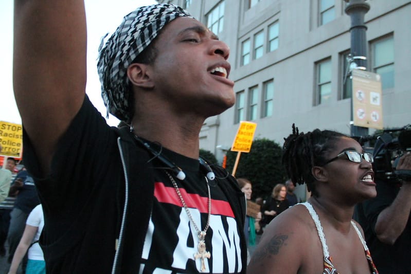 Two young Black people at a protest march in D.C.