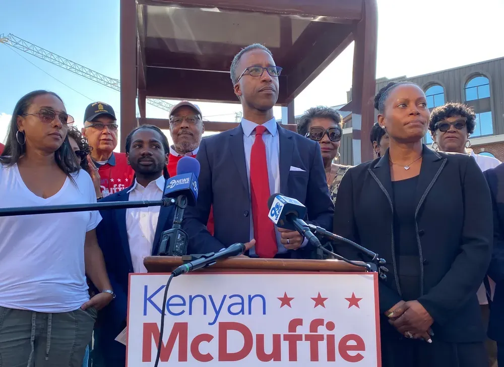 Kenyan McDuffie standing before a podium
