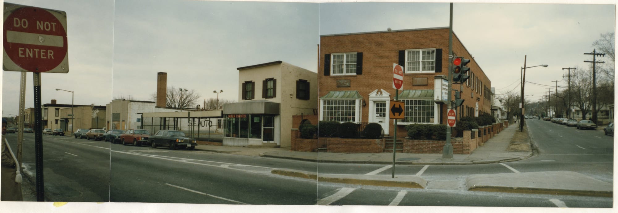 An archival photo of a street corner in D.C. with two "Do not enter" signs.