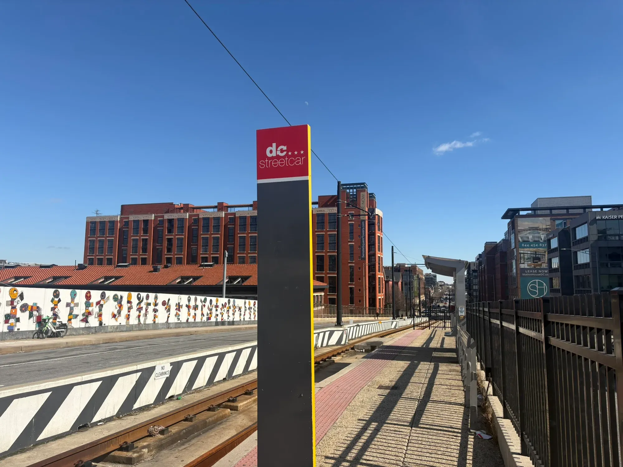 Photo of a marker for the DC streetcar on a bridge.