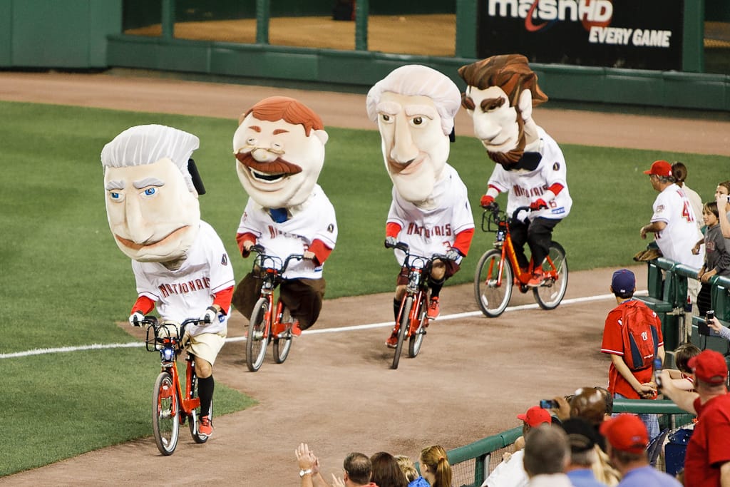The Washington Nationals presidents mascots ride Capital Bikeshare bikes