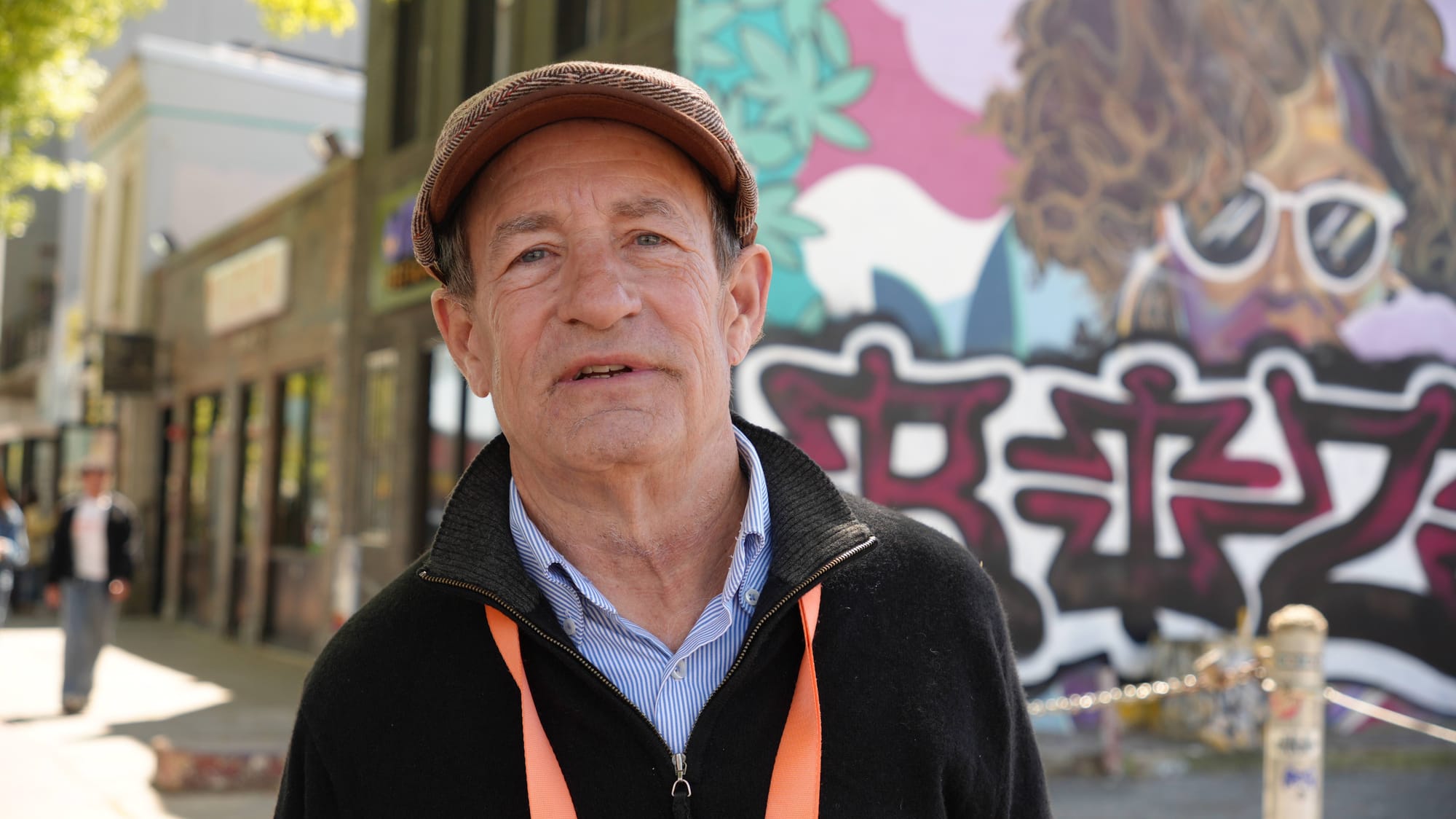 A photo of Terry Lynch looking at the camera as he stands on Georgia Avenue and Kenyon Street.