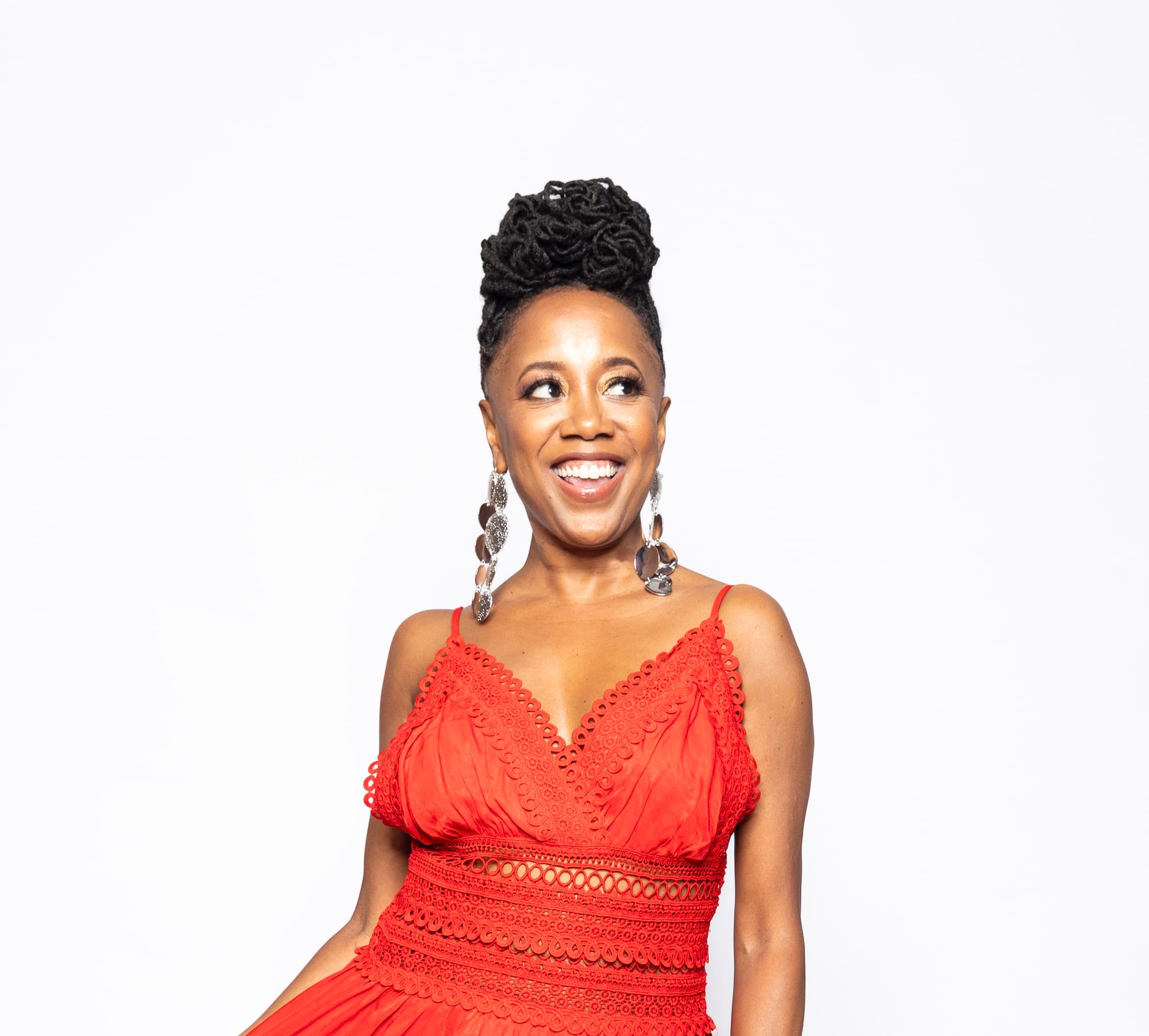 Deborah Bond in a red-orange dress