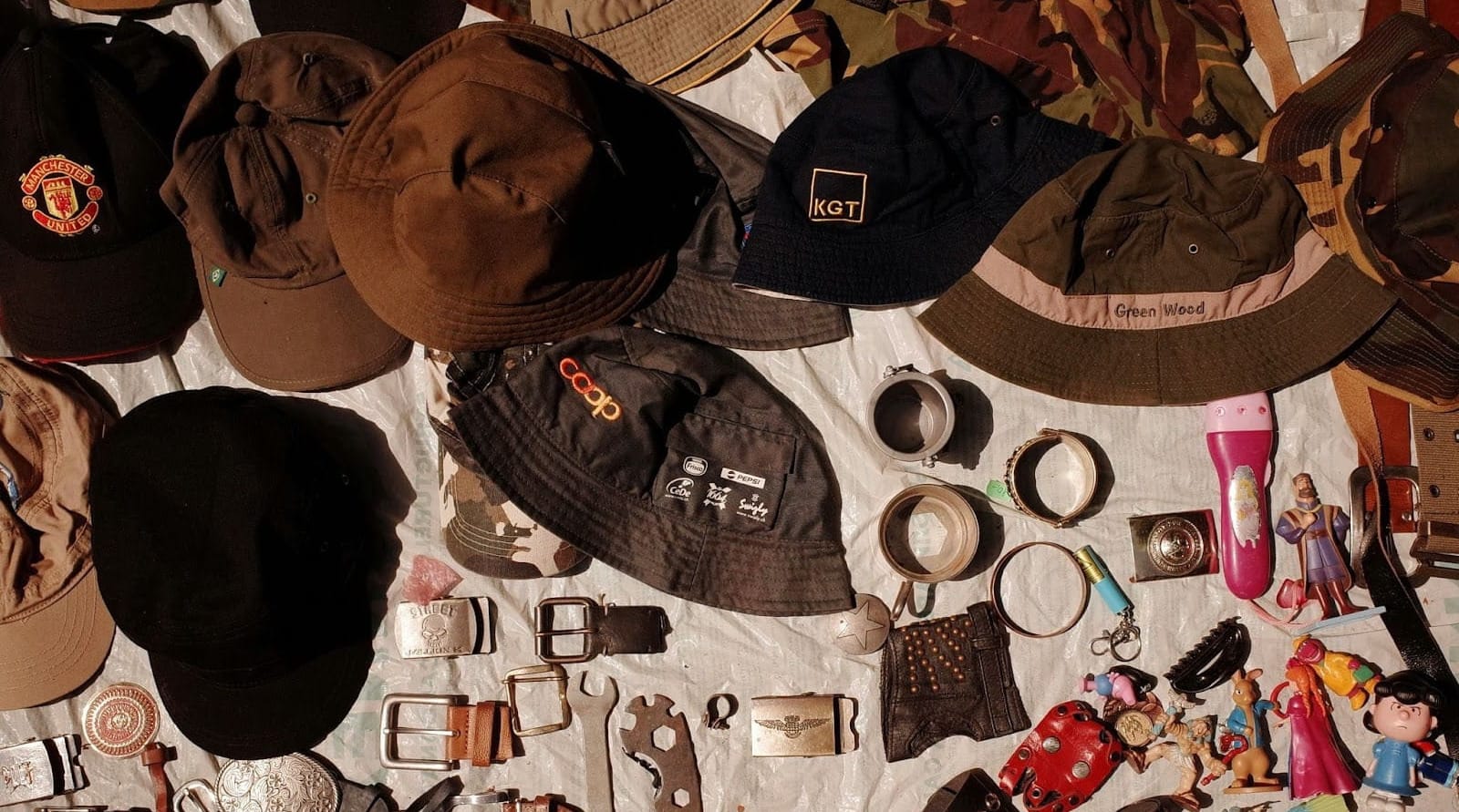Vintage goods displayed for sale on a tarp