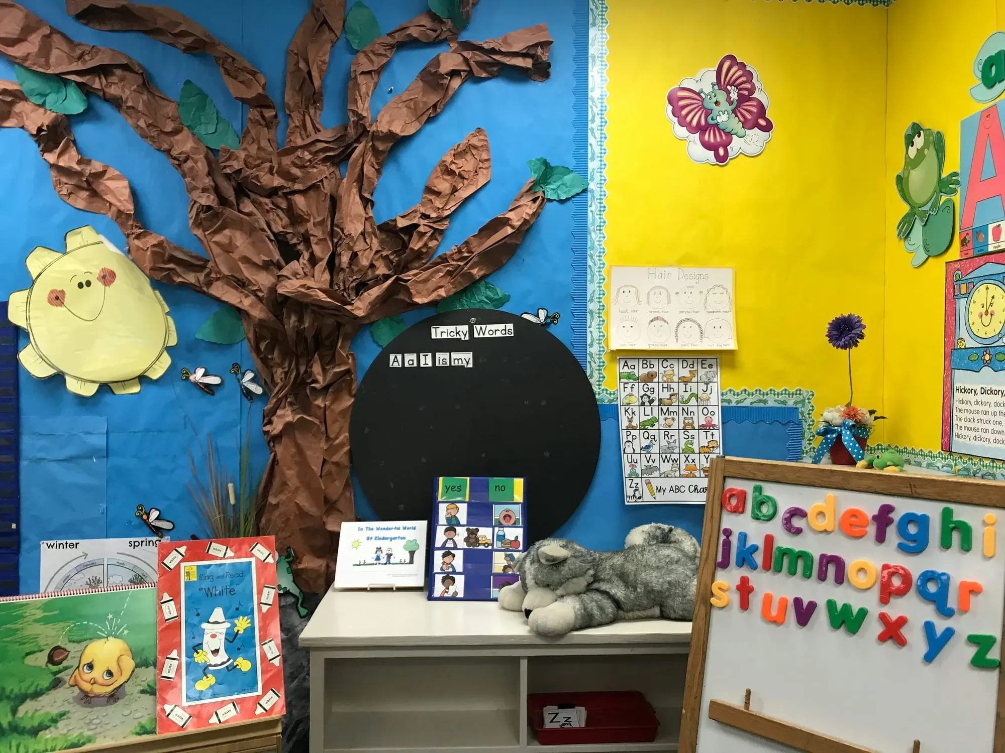 A classroom scene featuring a bulletin board tree, the alphabet, and more.