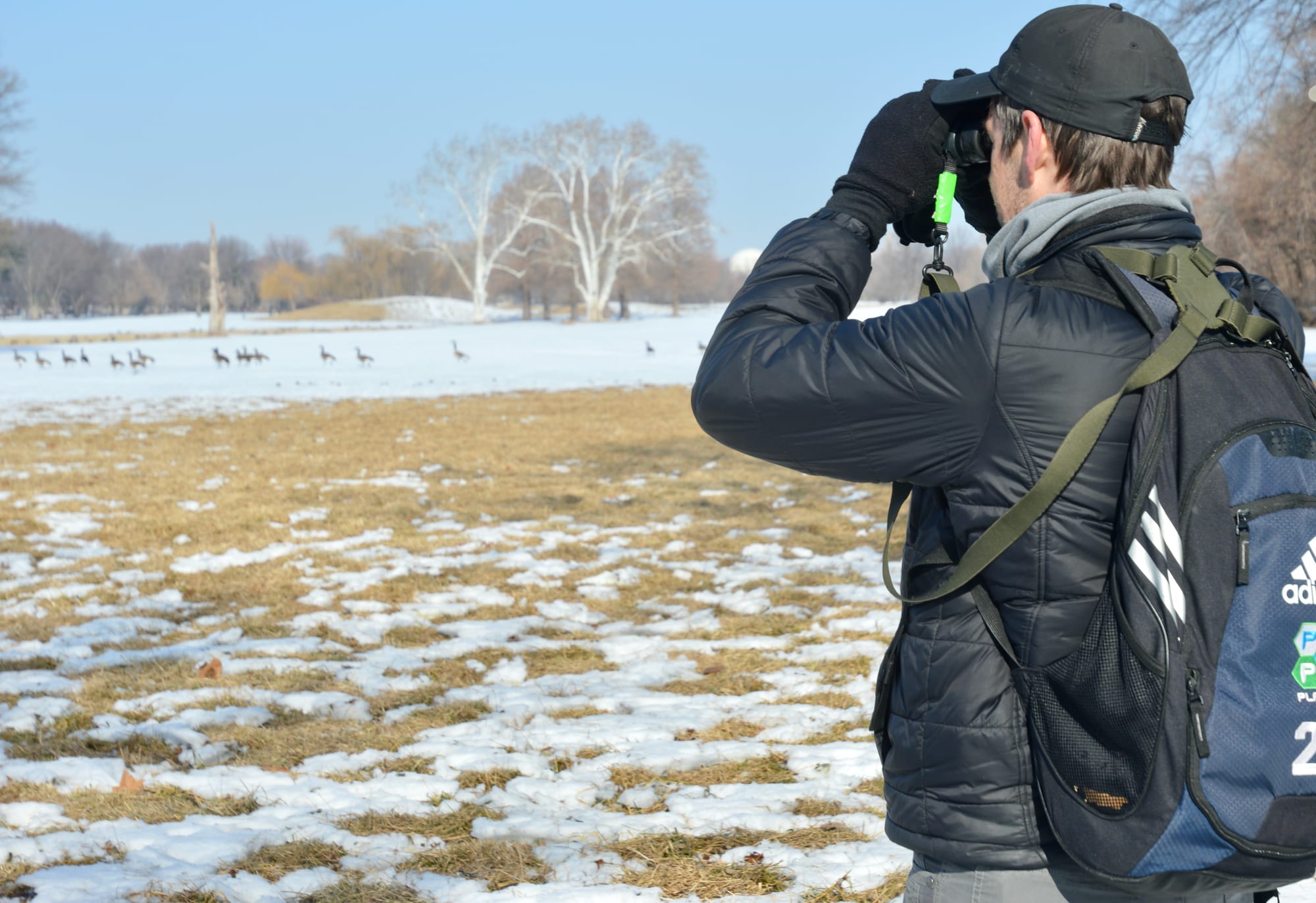 Dan Rauch peers through binoculars.