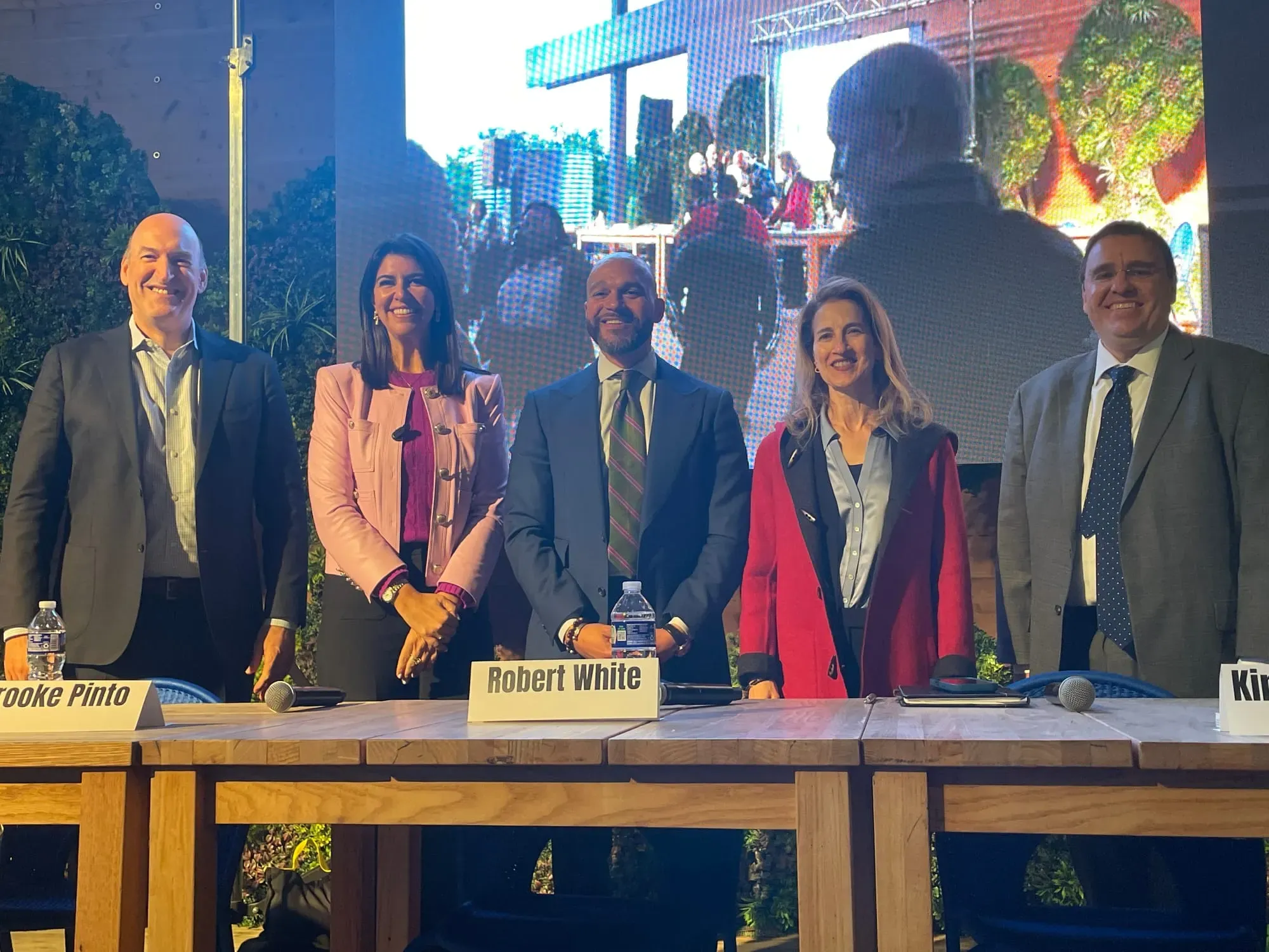 The five congressional delegate candidates pose together, from left to right: Greg Jaczko, Brooke Pinto, Robert White, Kinney Zalesne, and Trent Holbrook.