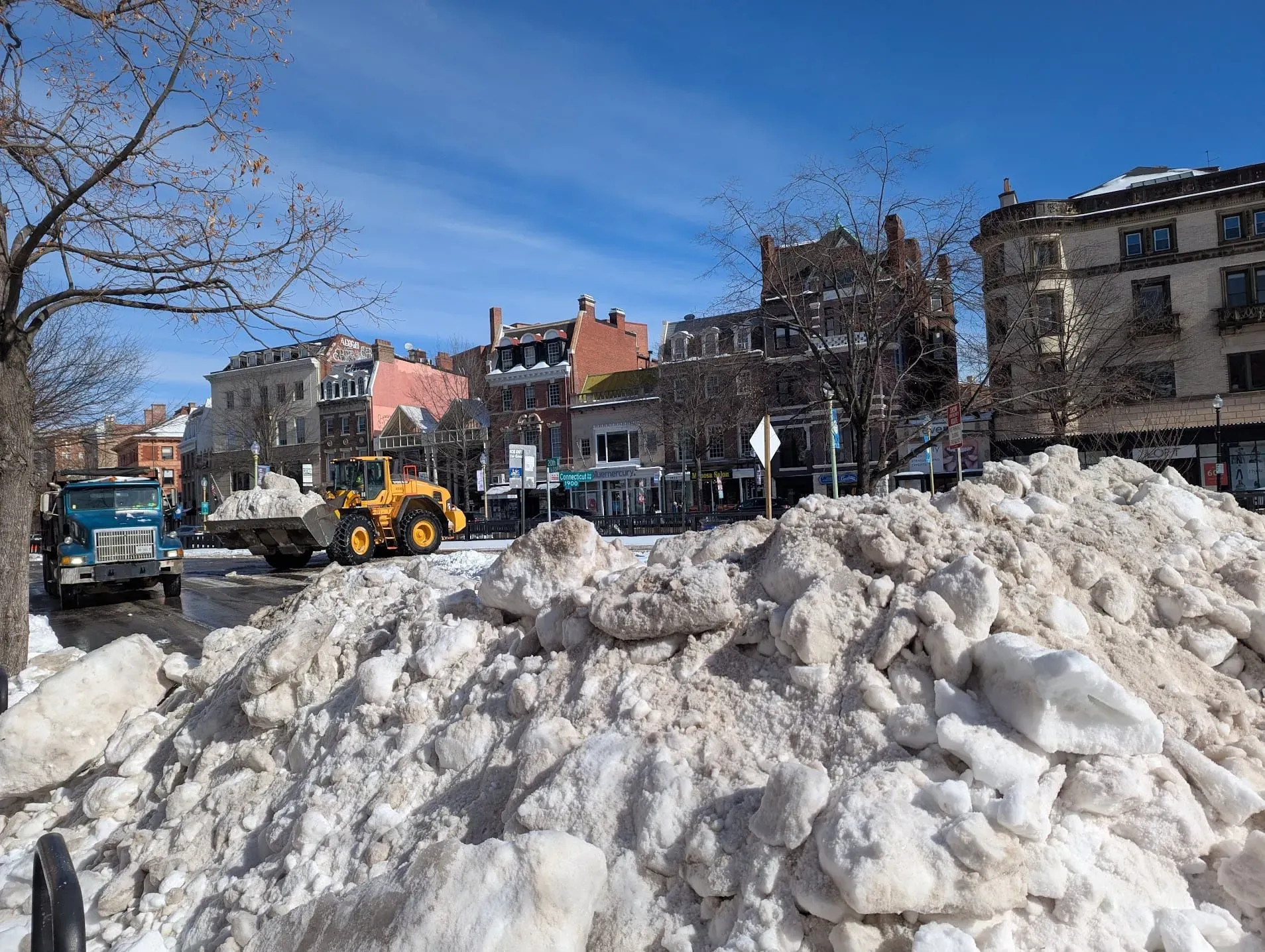 A photo of a pile of snowcrete on the street.