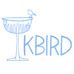 Image showing the name "Kbird" and an illustrated image of a bird perched on a cocktail glass.