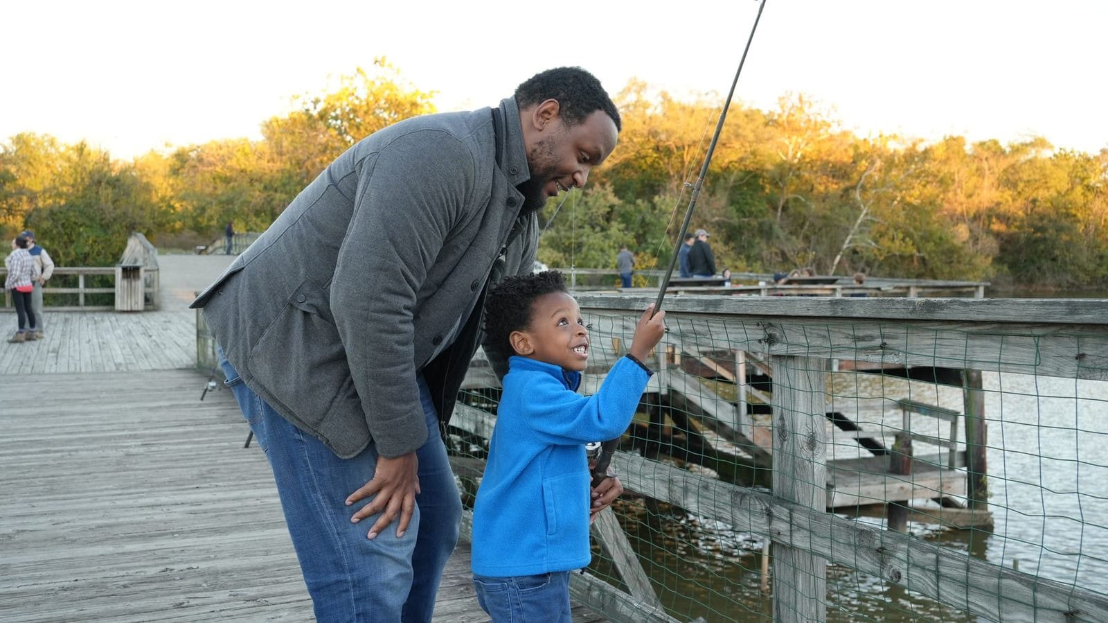 A young boy and a man fish at Washington, D.C.'s Kingman and Heritage Island