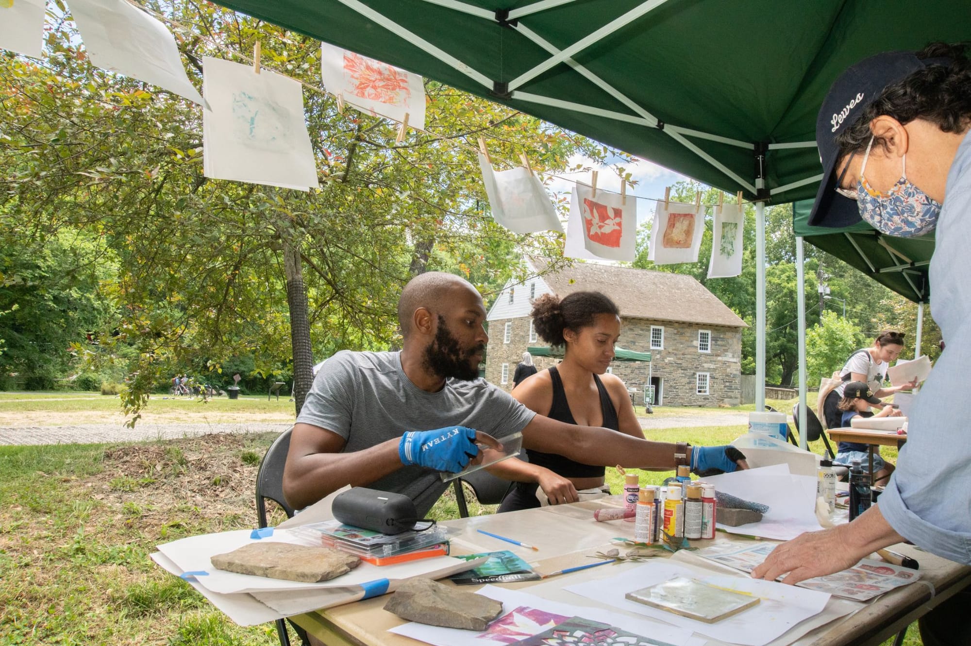 People make nature-inspired prints at Peirce Mill in Washington, D.C.