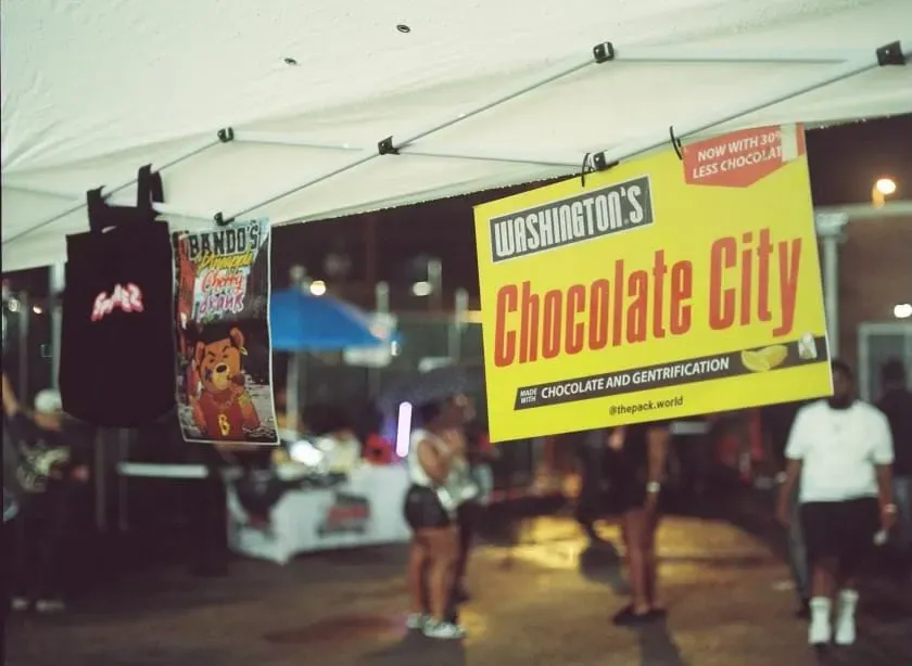 A picture of merch from Packworld including a print of a chocolate bar that reads "Chocolate City"