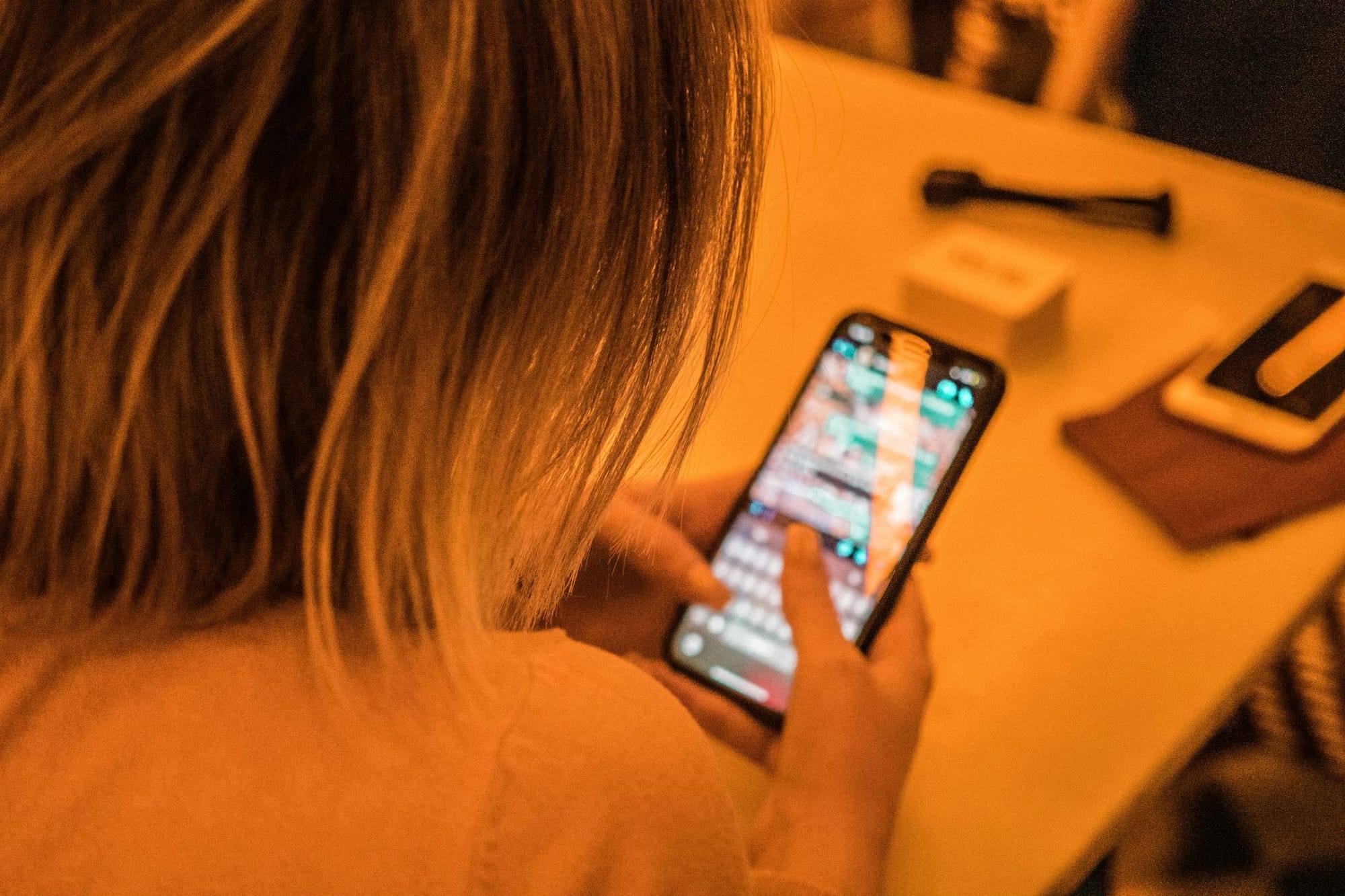 A person texts on a smartphone