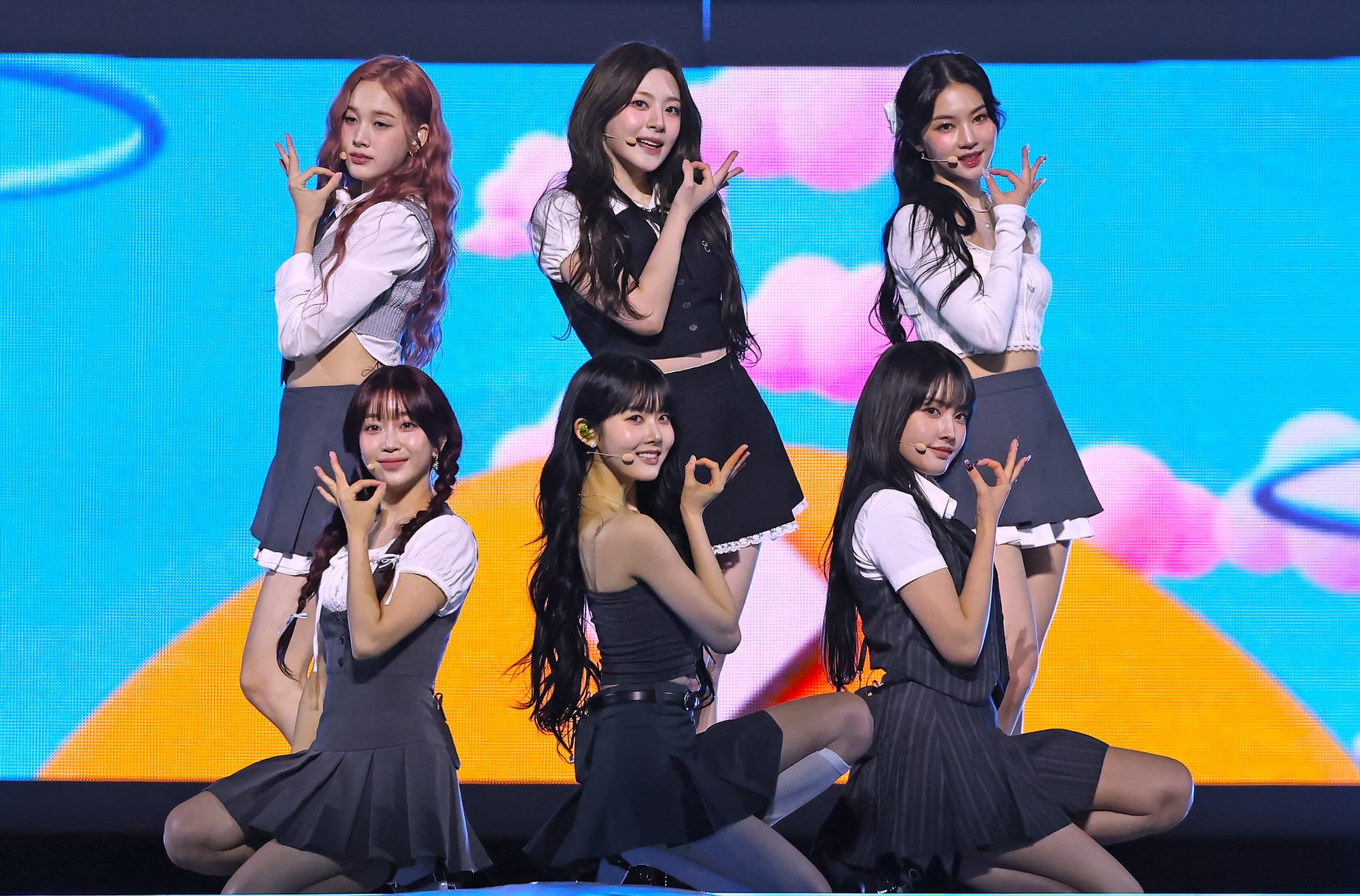 A six-member K-pop girl group performing together.