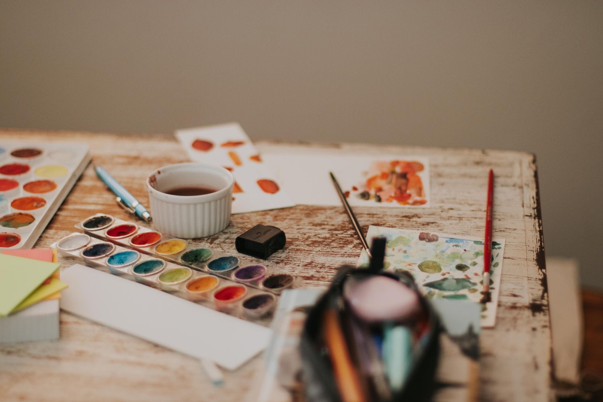 A watercolor setup on a wooden table.