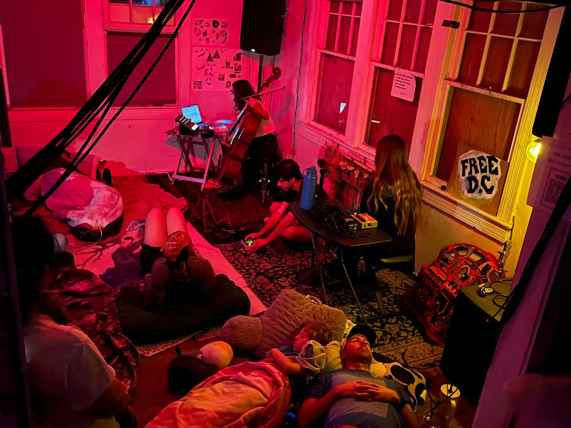 Drone music performers and resting audience members at Rhizome.