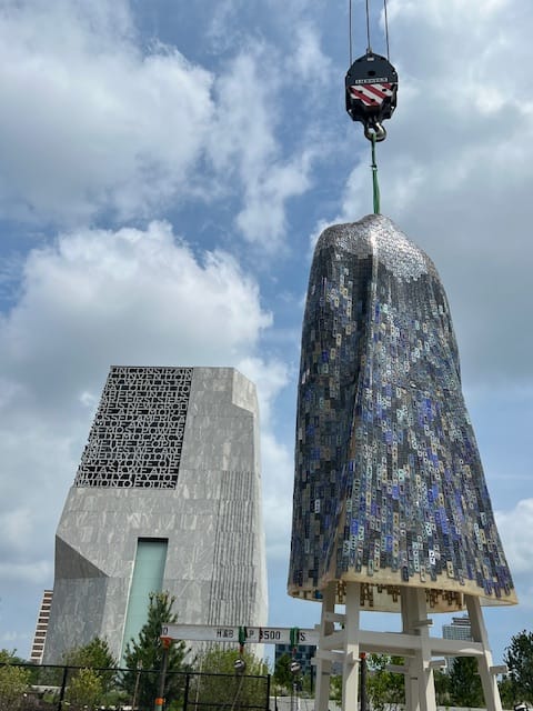 Durrett's 24-foot sculpture, "The Hem of Heaven," being lowered by crane at the Obama Center in Chicago.
