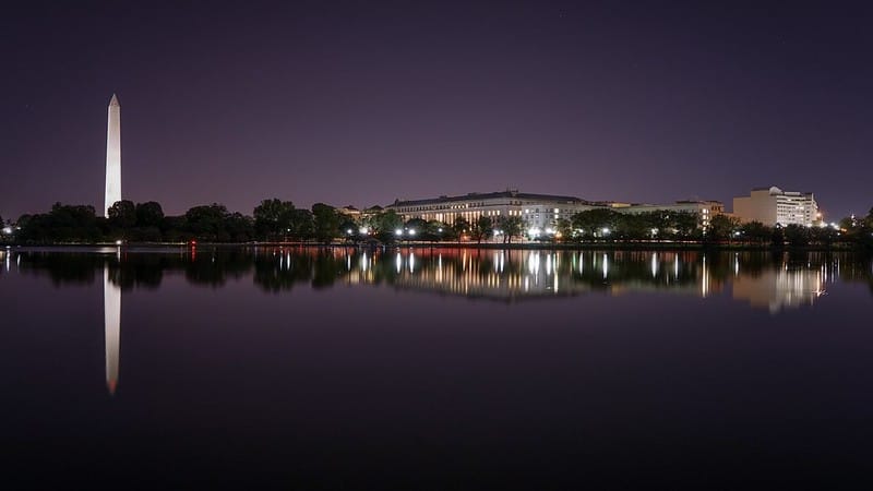 A wide angle shot of the National Mall at night. 