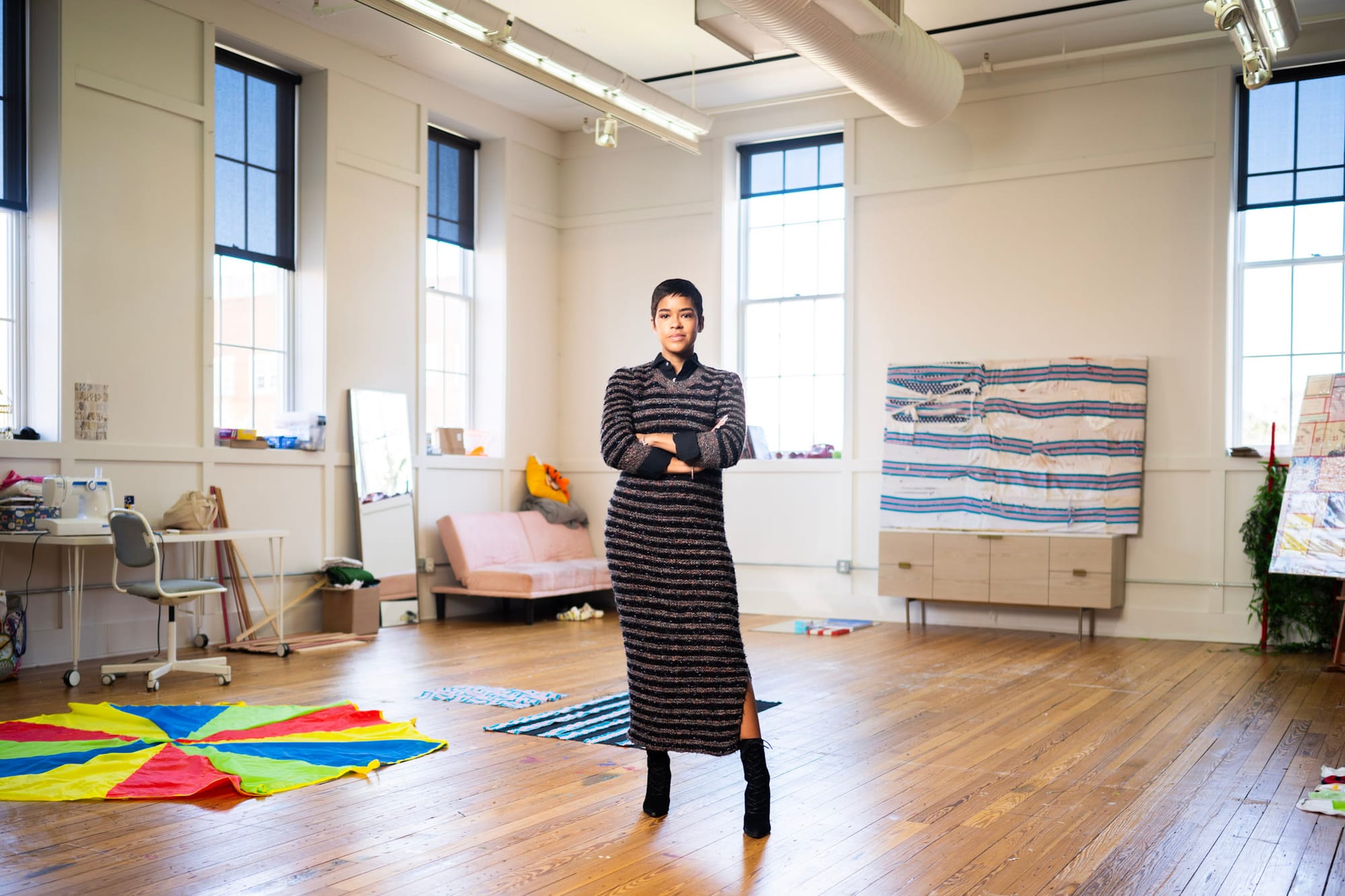 A portrait of artist Lex Marie in her studio.