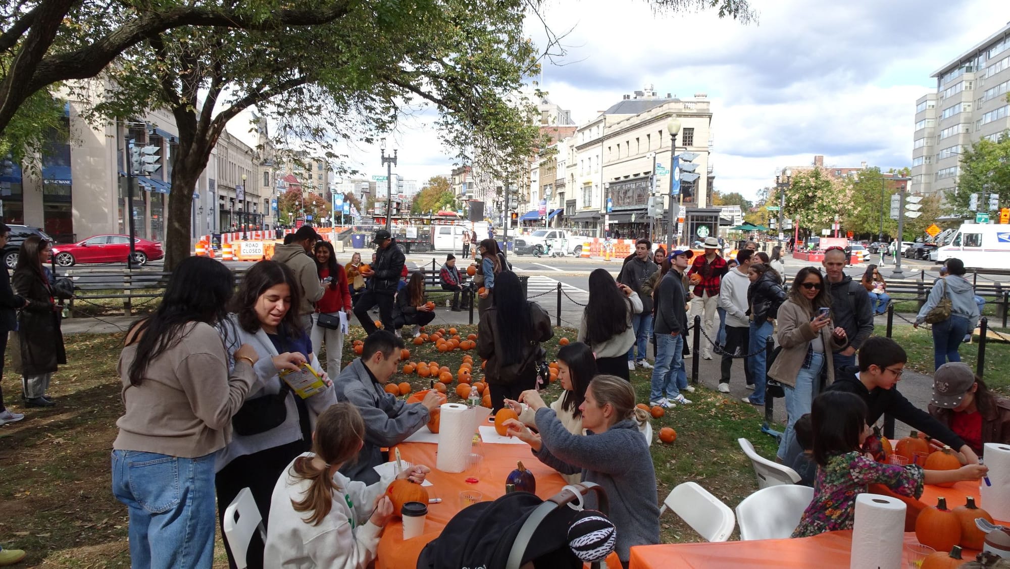 People carve pumpkins in D.C.'s Dupont Circle.