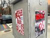 Wheatpasted red and white posters that read RIGHT THE LANDLORD LOBBY and SAVE TOPA.