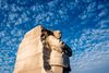 The Martin Luther King Jr. Memorial in Washington D.C. against a blue sky. 