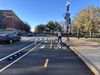 A biker in a protected bike lane near the monuments that is being removed by the Trump administration.
