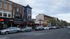A photo of cars parked along 18th Street Northwest in Adams Morgan, outside restaurants like Andy's Pizza, Bossa, and Tryst.