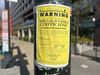 Closeup of a telephone pole with a poster that warns "this area has been declared a special juvenile curfew zone."