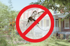 A photo collage of a mosquito with a red prohibition symbol over it, with rowhouses in the background.