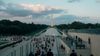 People gather outside across from the Washington Monument in D.C.