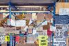 Posters calling for racial justice are taped to scaffolding