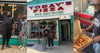 A collage showing the team behind Today's Pizza in front of their store and showing off a pizza packed with mumbo sauce, chicken, and fries.