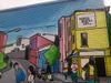 A mural of people in a city scene in D.C. 