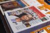 Photo of a stack of print editions, with an illustration of Janeese Lewis George on the cover. 