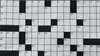 A black and white numbered crossword grid 
