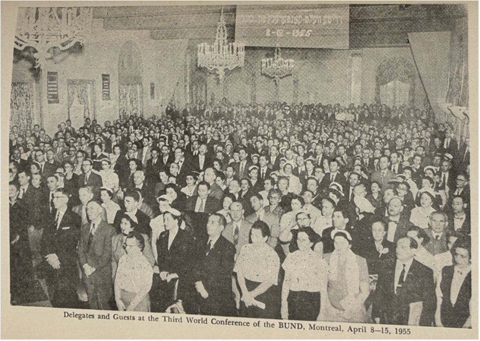A sepia tone photo of a large crowd in a ballroom, with the caption reading Delegates and Guests at the 3rd world conference of the BUND, montreal, apreil8-15, 1955