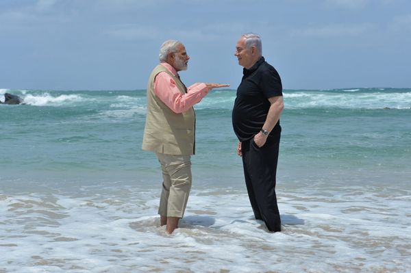 Modi & Netanyahu in the ocean with water up to their ankles