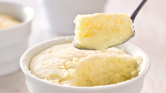 A single batter goes into the oven but comes out as a twofer: a souffle-like cake resting on top of a silky lemon pudding