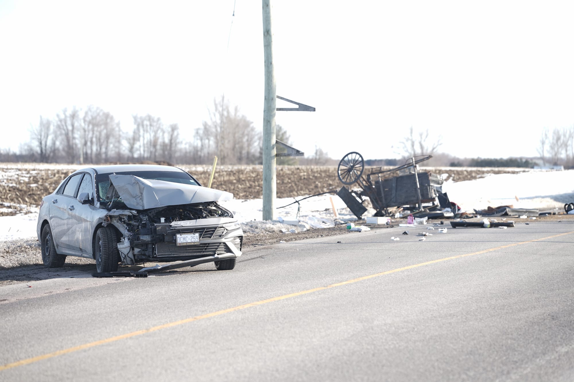 Collision between a car and a horse-drawn buggy