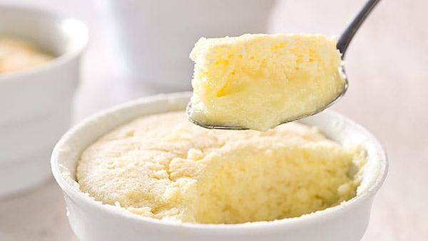 A single batter goes into the oven but comes out as a twofer: a souffle-like cake resting on top of a silky lemon pudding