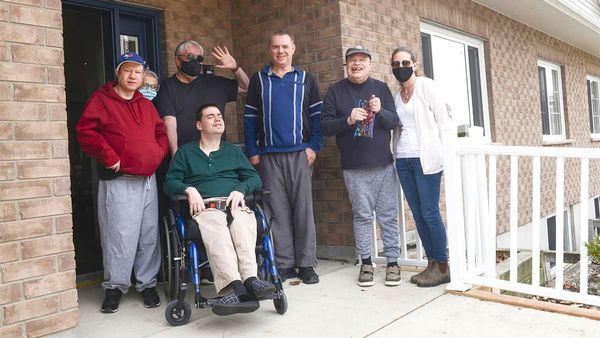 Residents move back into EDCL group home destroyed by fire last spring