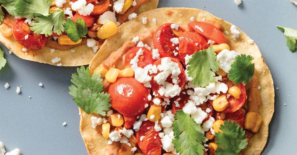 Crispy tostadas topped with beans and veggies