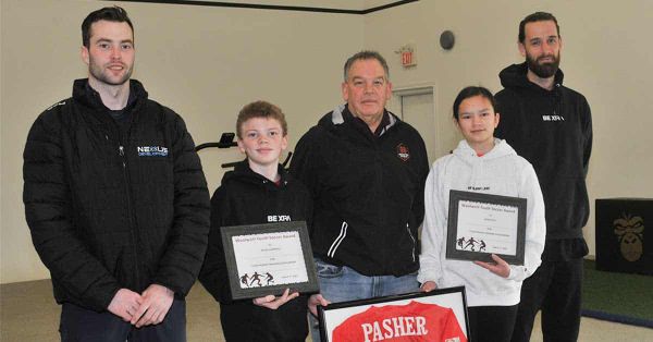 Two soccer players recipients of Pasher training awards