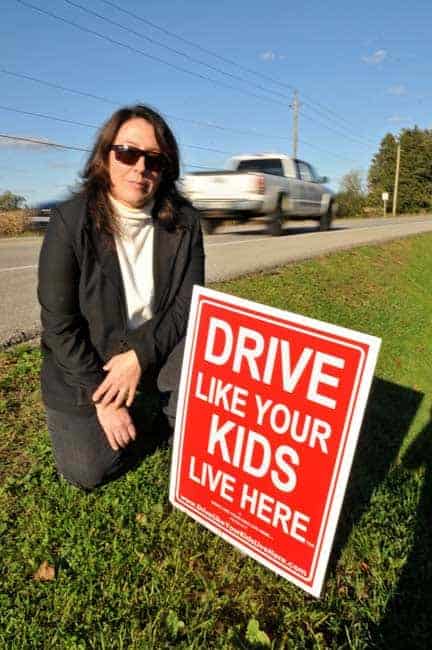 Part of a comprehensive attempt to calm traffic on St. Charles Street near her Bloomingdale home Audrey O’Hearn has posted signs for passing drivers.  [Elena Maystruk / The Observer]