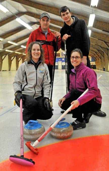 Colleeen Coghlin, Shawn Hamelin, David Miller, and Melody Martin keep their brooms on the ice at the Elmira Curling Club’s headquarters.[Will Sloan / The Observer]