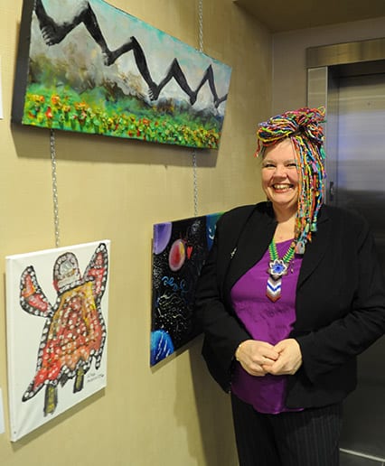 Kathryn Ssedoga is one of the artists whose work is on display in the exhibit. She submitted a piece made from melted wax that represented her healing from intergenerational trauma and complex post traumatic stress disorder.[Liz Bevan / The Observer]