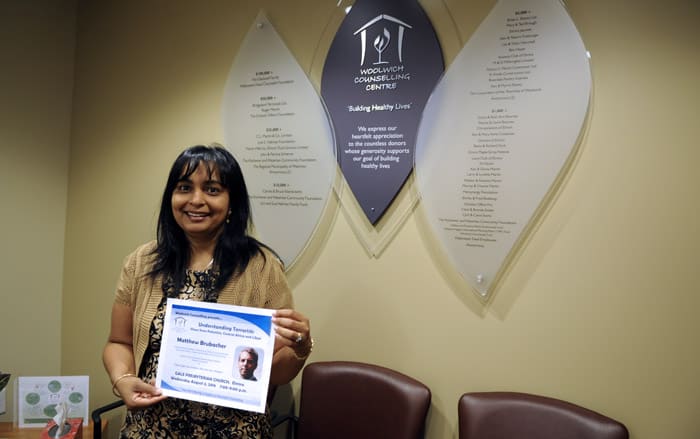 Hannah Harman of the Woolwich Counselling Centre shows one of the posters around town for Matthew Brubacher’s upcoming talk on terrorists.[Whitney Neilson / The Observer]