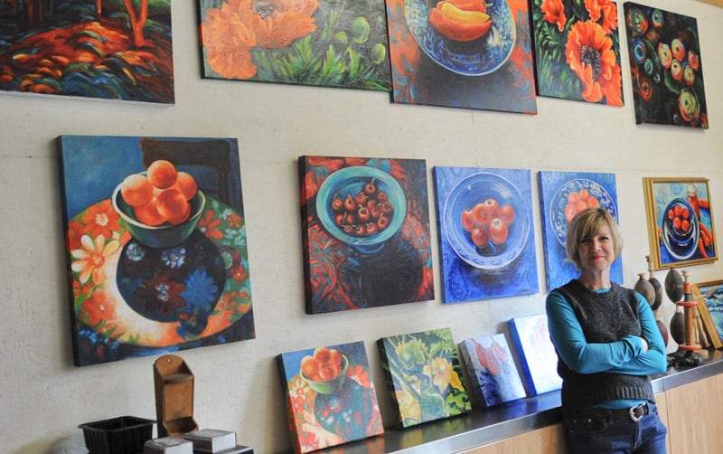 Laurie Stockton shows some of her paintings which will be for sale during the annual Kissing Bridge Trail Studio Tour on Oct. 22-23. The Ariss-based painter is one of 18 artists participating across 10 locations for this free event.[Whitney Neilson / The Observer]