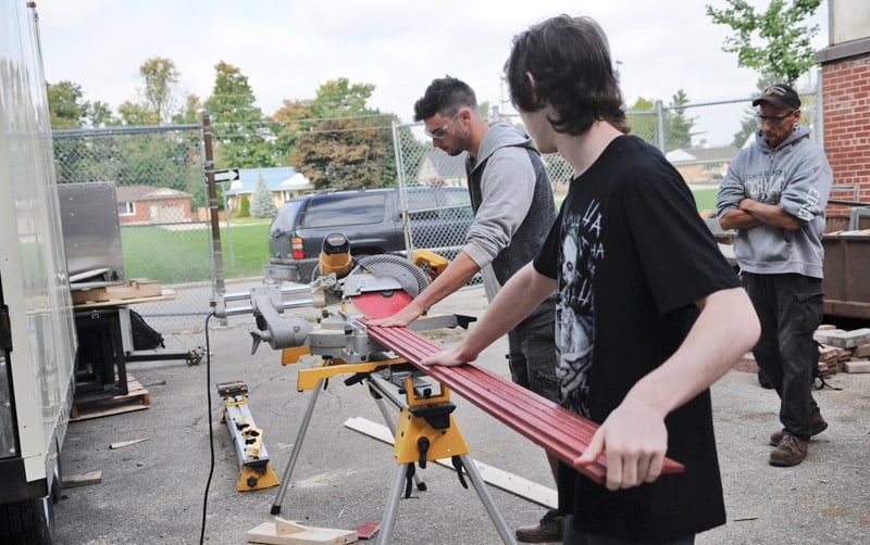EDSS Skills Canada and senior construction students have been volunteering their free time to build a shed to auction off with proceeds going to MennoHomes’ affordable housing project under construction in Elmira. Tech department head Randy Dyck says the students enjoy and want to be helping out with community based projects, where they can use their skills and talents towards helping others. [Whitney Neilson / The Observer]